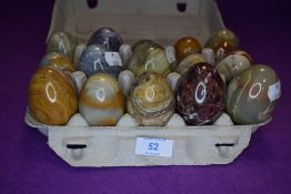 A selection of lathe turned stone agate and mineral eggs