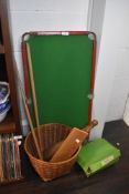 A miniature snooker table two cues and two Victorian style exercise batons or clubs