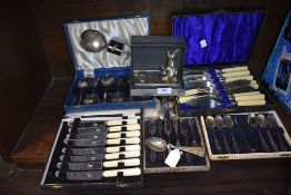 A good selection of cased cutlery and flat ware including HM silver spoons, knives cake forks etc