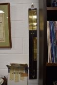 A modern mercury stick style barometer having brass detailing