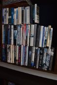 A large collection of books, predominantly autobiographical.