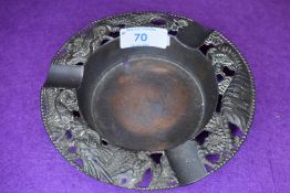 A vintage pewter Japan ashtray having tiger, blossom,chrysanthemums and dragon.