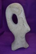 A stone sculpture or art work hand carved and worked in a Barbara Hepworth styled design