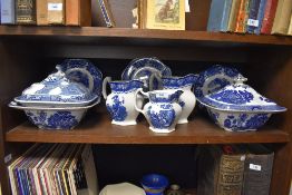 A selection of antique blue and white tureens,plates and graded jugs.