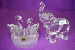 A Royal Crystal rock swan figurine and Waterford Crystal elephant
