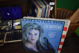 A selection of 90's dance and pop rock singles vinyl and records