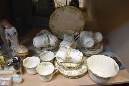 A late Victorian tea service having green and floral decor