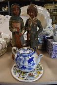 A small Chinese export tea pot circa 1850 having blue and white design with tea strain inner and