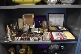 A fine selection of table wares and settings including cased cutlery and plated wares