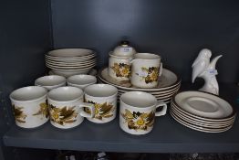 A collection of retro Doverstone pottery including plates, cups, saucers,bowls and more.