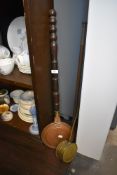 A copper post horn and two chestnut roasters one brass and one traditional copper