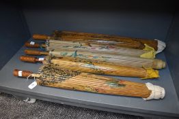 Five Chinese sun parasol or umbrella being bamboo in design with hand painted designs condition fair