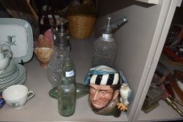 A selection of pub bar items including claret jug Doulton jug and Soda syphon