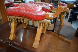 A beech wood camel stool in the form of a camel