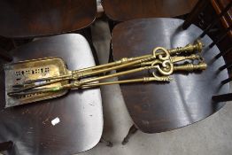 A selection of brass fire irons