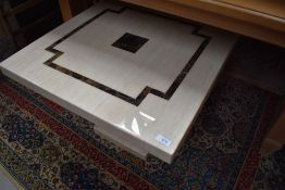 A heavy set low stone effect coffee or display table