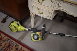 A petrol motor Ryobi garden strimmer