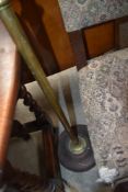 An early 20th Century standard lamp having wood base and brass column