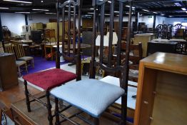 A pair of unusual hall way high backed chairs on turned oak frames