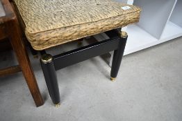 A vintage bow topped dressing table stool having vinyl seat