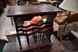 A side table magazine rack in mahogany having under drawer