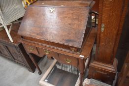 A Period oak lowboy (side table) with 'married' desk top, table width approx. 85cm