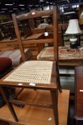 a bedroom salon chair having bergere seat and veneer inlayed details