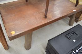 An oak coffee table or similar low bench