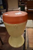 A vintage toughened plastic sewing box, similar material and design to the iconic mushroom chairs of