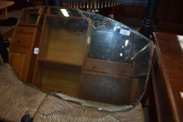 An art deco hall way mirror having bevel edged glass in a scalloped style