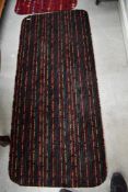 A vintage mid century carpet rug with a retro design