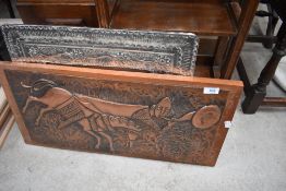 A vintage copper work plaque 'Roland blew his horn' and a metal work mirror