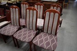 A set of six stained frame and partially reupholstered dining chairs