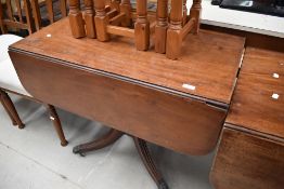 A Regency style mahogany (probably early 20th Century reproduction) pembroke style dining table