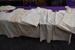 A good quantity of Victorian nightdresses,shifts, camisoles and aprons,some age staining.