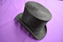 An antique top hat 'R.W.T.K Thompson Kendal' internal measurement approx 21' height approx 6',some