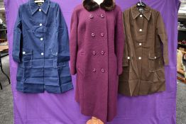 A 1960s purple wool coat with faux fur collar and two 1960s short Mac style coats, one navy the