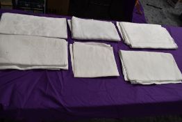 Six antique damask table cloths.