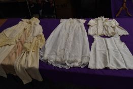 An antique wool christening shawl or similar,a tulle babies gown and more.