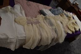 A selection of vintage and antique childrens and babies items including dresses, bonnet, under
