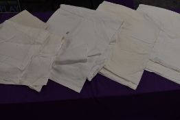 A selection of vintage white flat sheets.