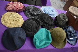 A hat case containing assorted vintage hats, 1940s to late 60s/early 70s.