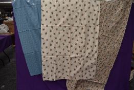 Three lengths of vintage fabrics including bright floral cottons.