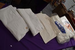 A collection of vintage and antique bed sheets, a lot still in original packaging, including