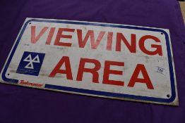 A vintage garage sign for Viewing Area Vehicle Testing Station