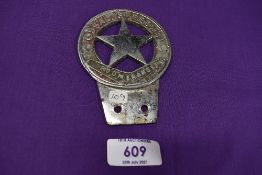 A motor car engine badge for the Odsal Speedway Boomerangs motor cycles