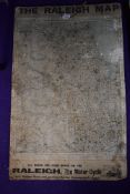 A garage advertising map sign for Raleigh Motor Cycle