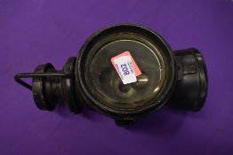 A genuine motor car nearside head lamp by P and H or Powell and Hammer