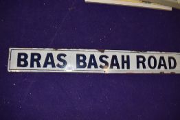 A vintage road side enamel sign reading Bras Basah Road