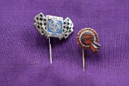 A BMC and a Leyland tie pin.